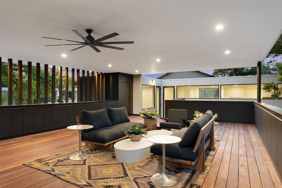Wooden terrace with an outdoor hangout area and ceiling fan Wooden terrace with an outdoor hangout area and ceiling fan