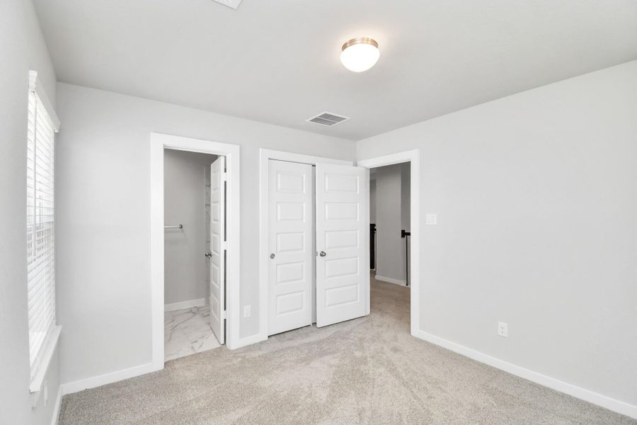 Generously sized secondary bedrooms featuring spacious closets, soft and inviting carpeting underfoot, large windows allowing plenty of natural light, and the added touch of privacy blinds for your personal retreat. Generously sized secondary bedrooms featuring spacious closets, soft and inviting carpeting underfoot, large windows allowing plenty of natural light, and the added touch of privacy blinds for your personal retreat.