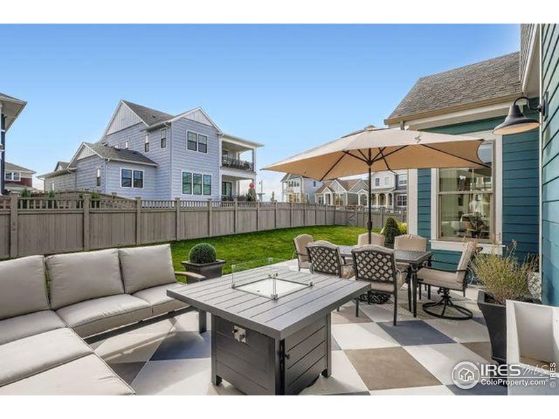 Expansive back custom porcelain patio, with large open yard for gathering Expansive back custom porcelain patio, with large open yard for gathering