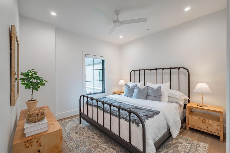 Bedroom with wood-type flooring and ceiling fan