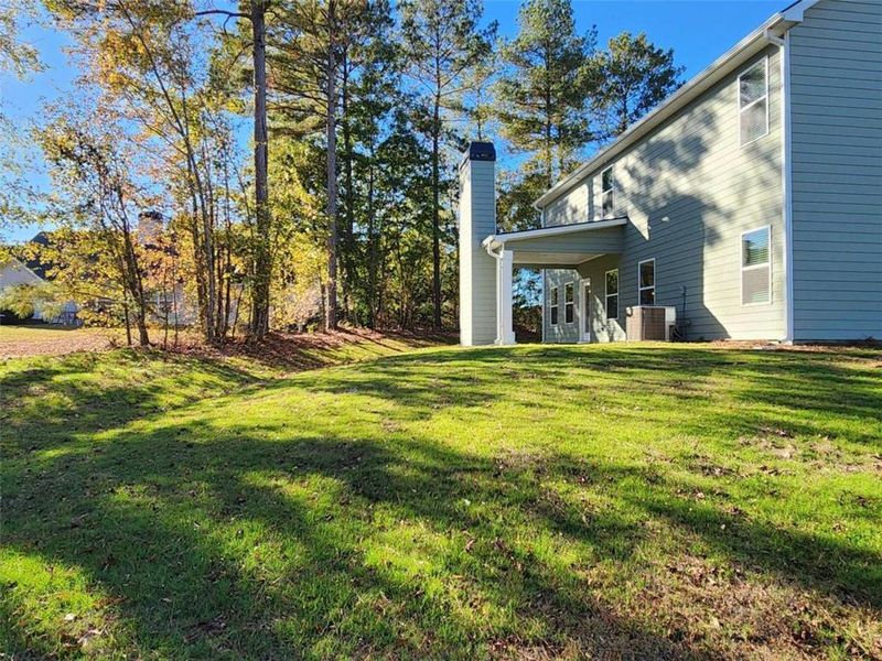 Exterior details and patio area of a home in The Woodlands Preserve, Jackson (Image 4).