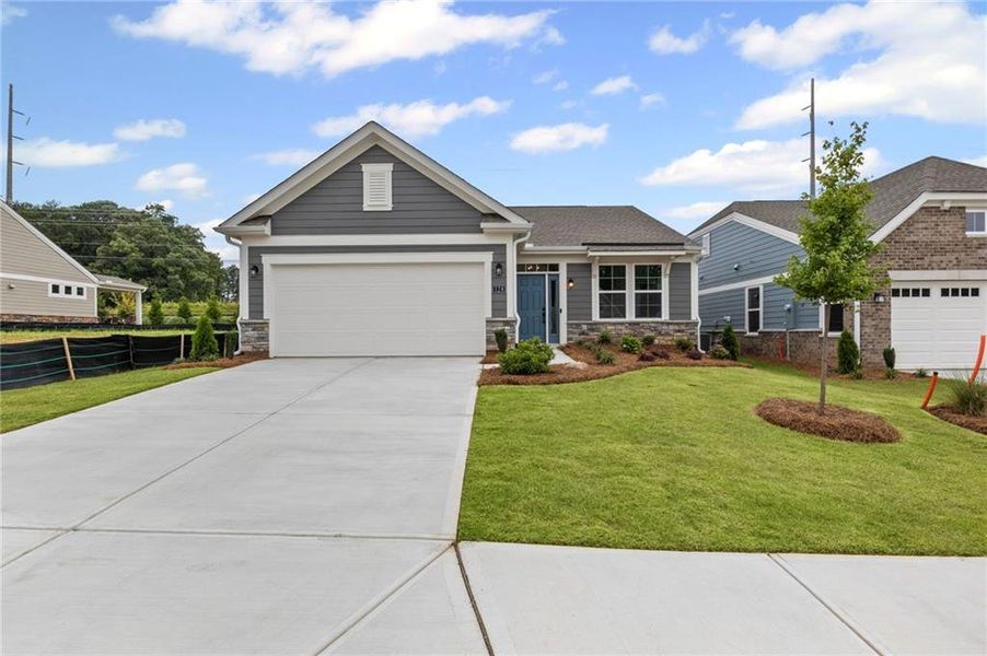 Front exterior of a new home in Laurel Farms, Dallas, GA, highlighting curb appeal (Image 1). Front exterior of a new home in Laurel Farms, Dallas, GA, highlighting curb appeal (Image 1).