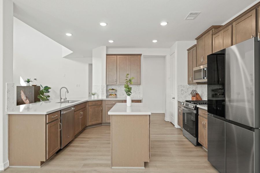 The Kitchen features ample countertops and workspace for everyday meals or entertaining.