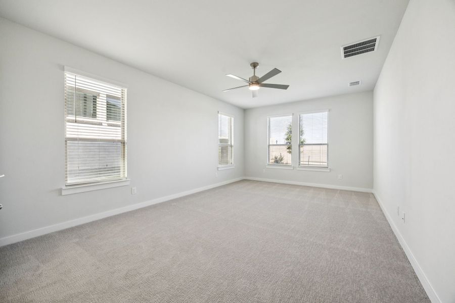 Primary Suite in the Wimbledon home plan by Trophy Signature Homes – REPRESENTATIVE PHOTO