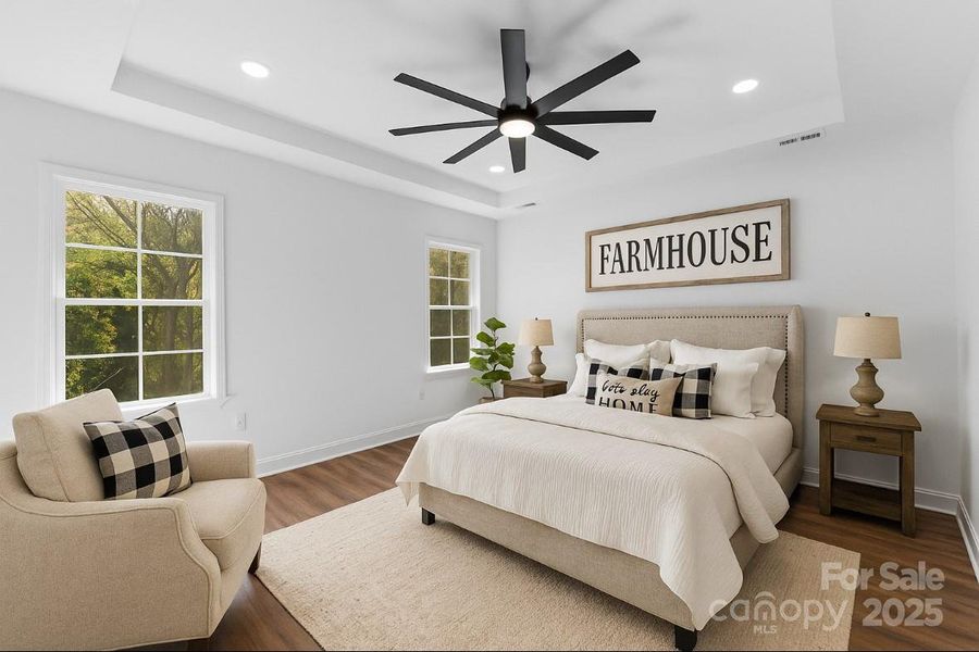 *virtually staged* primary bedroom w/ tray ceiling *virtually staged* primary bedroom w/ tray ceiling