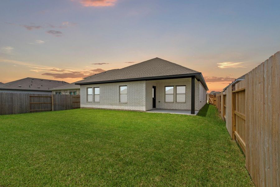 Exterior details and patio area of a home in Windrose Green, Angleton (Image 3).