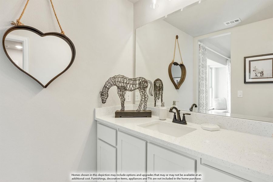 Bathroom vanity with white cabinets, quartz countertop, single sink, and heart-shaped decorative mirror on the wall. Bathroom vanity with white cabinets, quartz countertop, single sink, and heart-shaped decorative mirror on the wall.