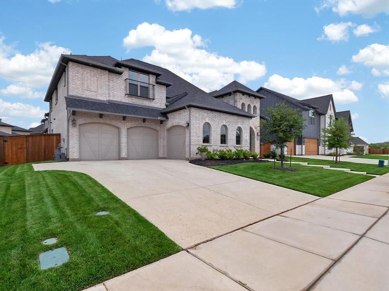 Front exterior of a new home in Light Farms Graham/Reagan, Celina, TX, highlighting curb appeal (Image 24).
