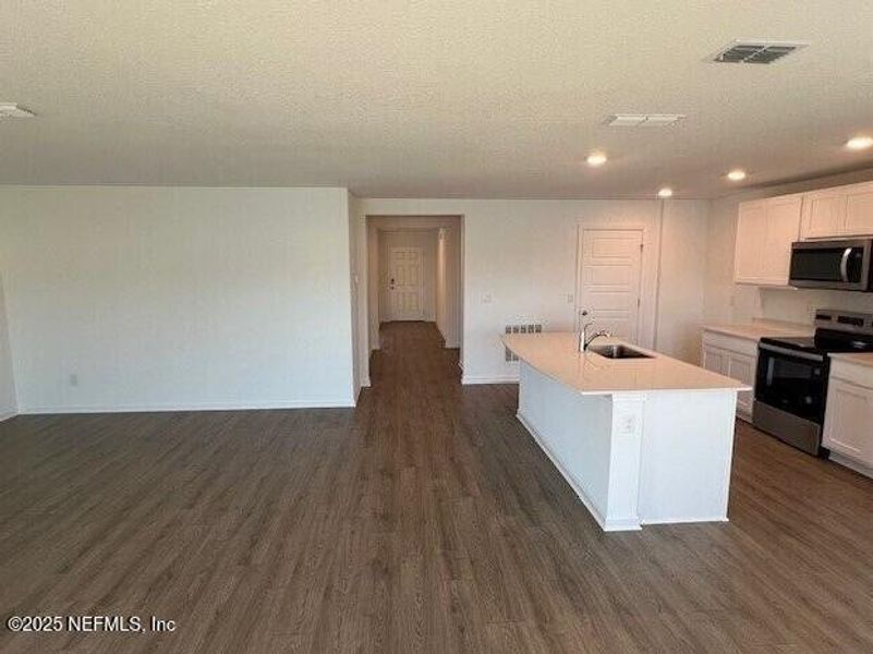 Furnished interior view inside a new home in Sawmill Branch, Palm Coast (Image 6). Furnished interior view inside a new home in Sawmill Branch, Palm Coast (Image 6).