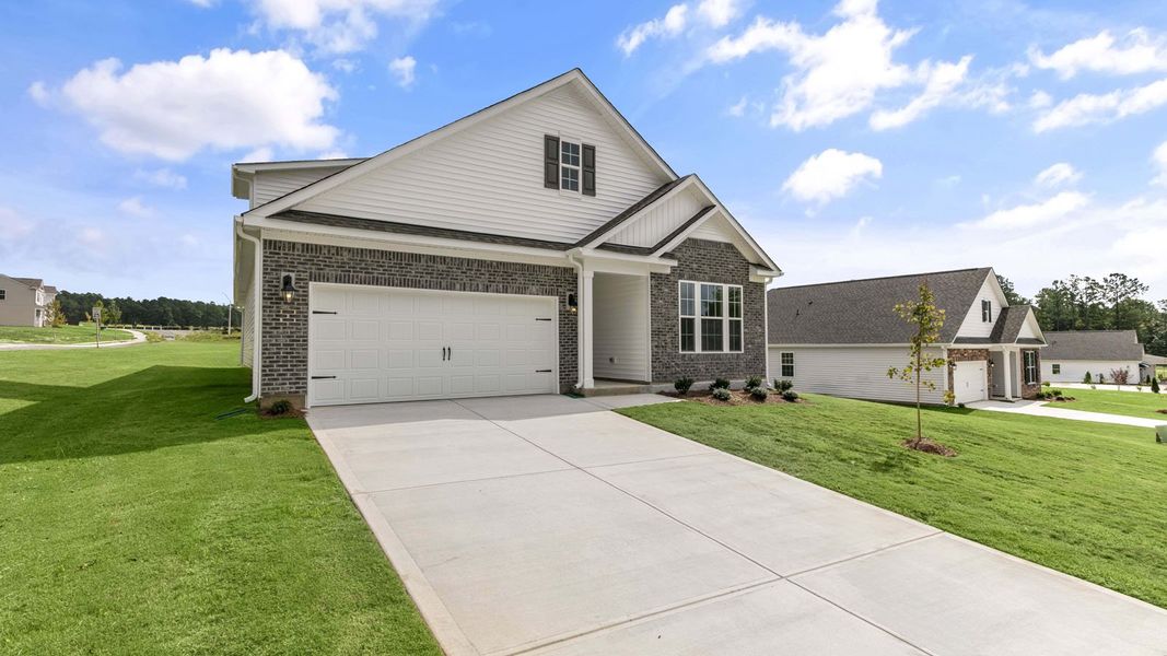 Front exterior of a new home in The Villas at Martin Farms, Aberdeen, NC, highlighting curb appeal (Image 2). Front exterior of a new home in The Villas at Martin Farms, Aberdeen, NC, highlighting curb appeal (Image 2).