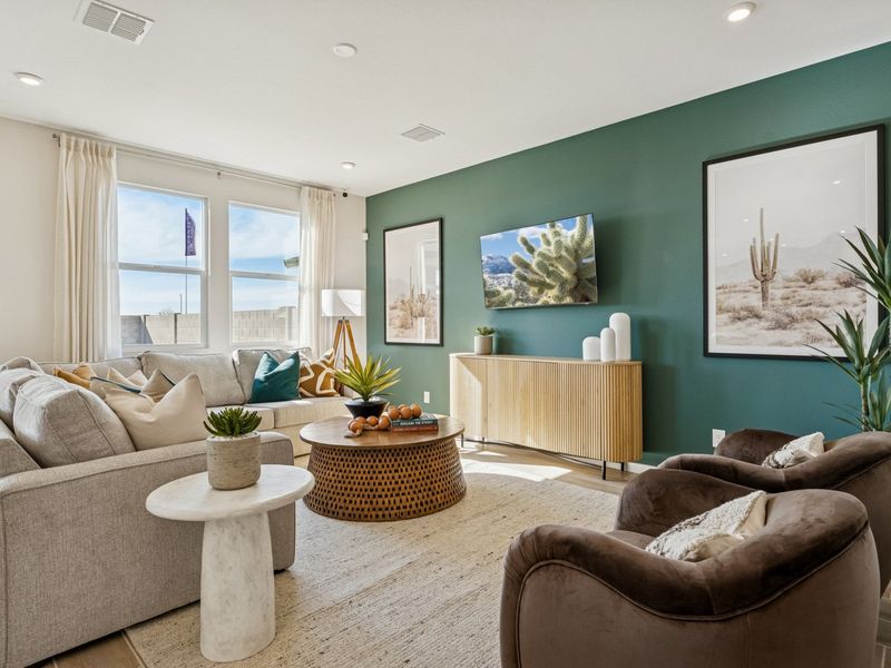 A living room with a green wall. A living room with a green wall.