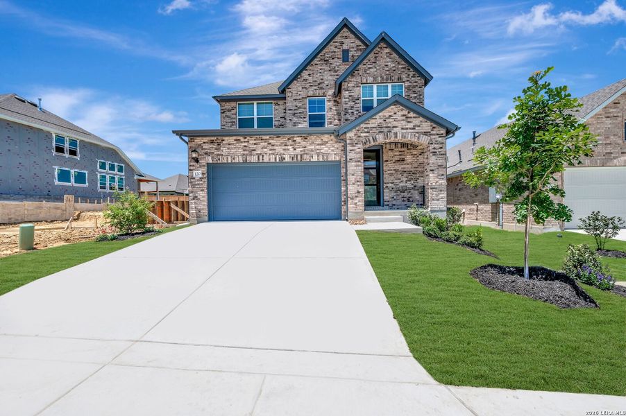 Front exterior of a new home in Mayfair - Select Garden Series, New Braunfels, TX, highlighting curb appeal (Image 1). Front exterior of a new home in Mayfair - Select Garden Series, New Braunfels, TX, highlighting curb appeal (Image 1).
