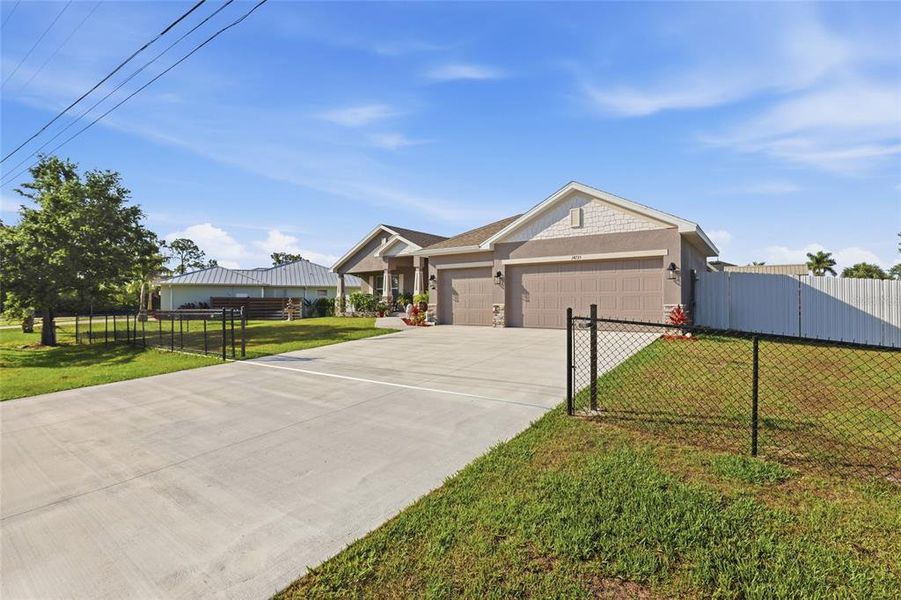 Front exterior of a new home in South Gulf Cove, Port Charlotte, FL, highlighting curb appeal (Image 21).