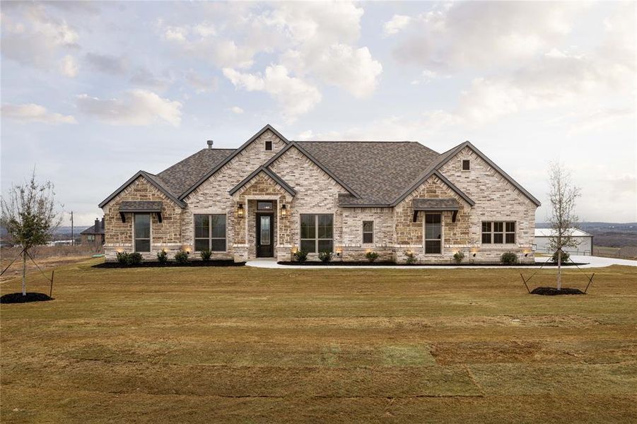 View of front of property with a front lawn