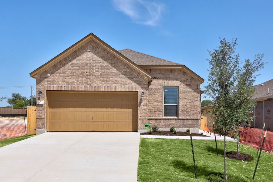 Front exterior of a new home in Overlook Ranch, Georgetown, TX, highlighting curb appeal (Image 1). Front exterior of a new home in Overlook Ranch, Georgetown, TX, highlighting curb appeal (Image 1).