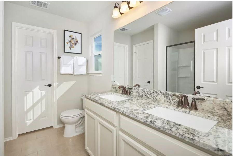 Photo of Pulte model home with same floor plan, not of actual home listed.