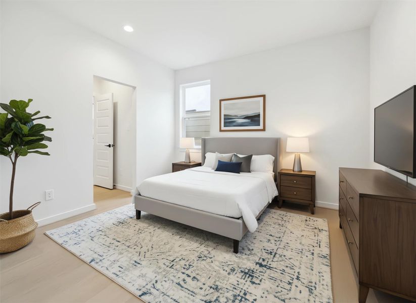 Secondary bedroom off the guest suite features a soothing neutral palette and warm natural light. Ideal for guests or a home office, it offers comfort and privacy with its attached ensuite bath. *Virtually staged*