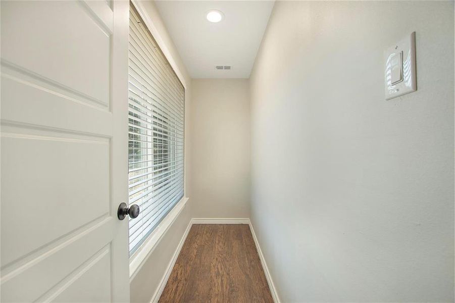 Corridor featuring dark wood-style floors and recessed lighting Corridor featuring dark wood-style floors and recessed lighting