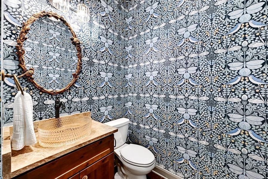 Half bath with vanity and toilet