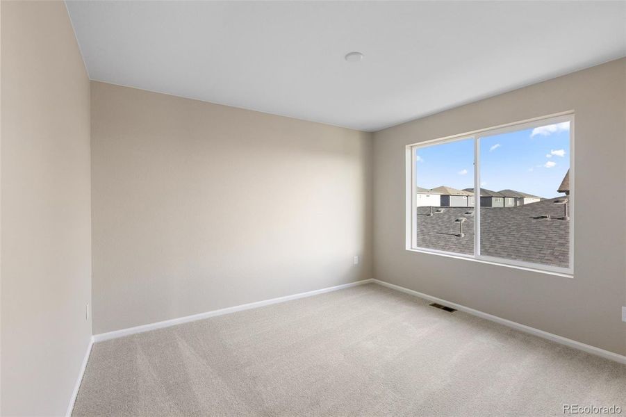 Spacious, unfurnished interior of a new home in The Cottages Collection at Ridgeline Vista, Brighton (Image 17).