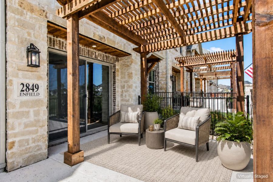 Exterior details and patio area of a home in The Tribute, The Colony (Image 25).