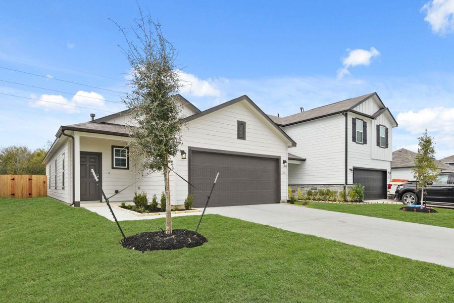 Front exterior of a new home in Barrett Crossing, Crosby, TX, highlighting curb appeal (Image 16).