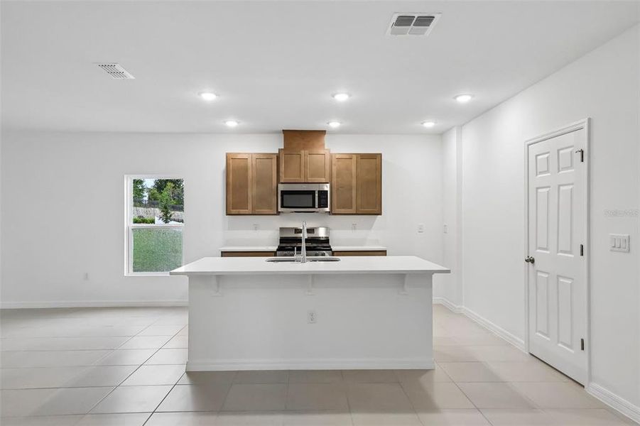Furnished interior view inside a new home in Eagletail Landings, Howey-in-the-Hills (Image 9).