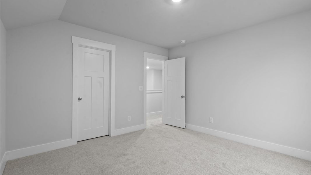 First-class secondary bedroom with comfortable carpeted flooring and generous closet space First-class secondary bedroom with comfortable carpeted flooring and generous closet space