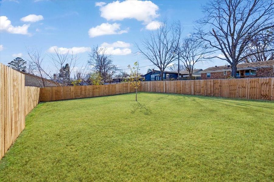 Exterior details and patio area of a home in Miller Street Cottages, Denison (Image 14).