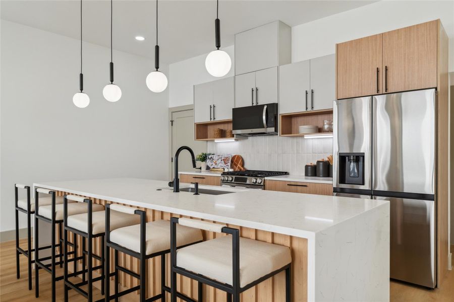 The warmth of fluted wood and the coolness of stone strike the perfect balance—refined yet inviting, just like the rest of the home.