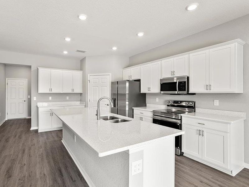 Your beautiful, new kitchen includes a counter-height island, walk-in pantry, and ample space - Aubrey by Highland Homes Your beautiful, new kitchen includes a counter-height island, walk-in pantry, and ample space - Aubrey by Highland Homes