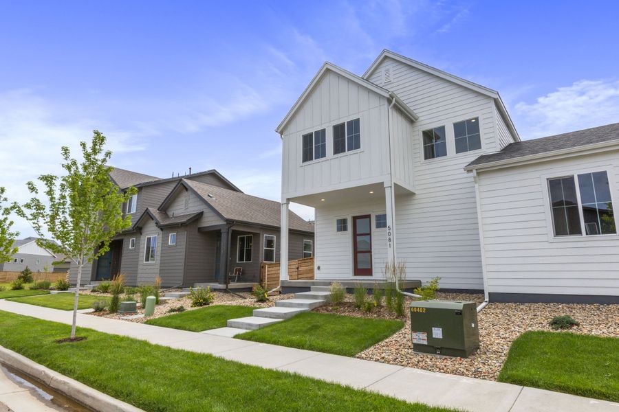 Front exterior of a new home in Trailside on Harmony, Timnath, CO, highlighting curb appeal (Image 26).