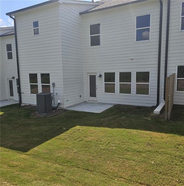Front exterior of a new home in , Loganville, GA, highlighting curb appeal (Image 21).