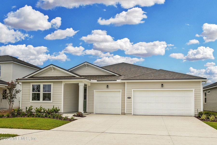 Front exterior of a new home in Lakes at Bella Lago, Green Cove Springs, FL, highlighting curb appeal (Image 1).