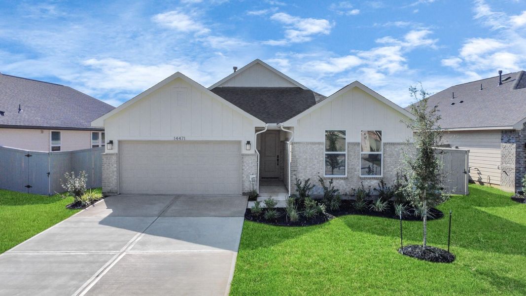 Front exterior of a new home in The Canopies, Splendora, TX, highlighting curb appeal (Image 15).