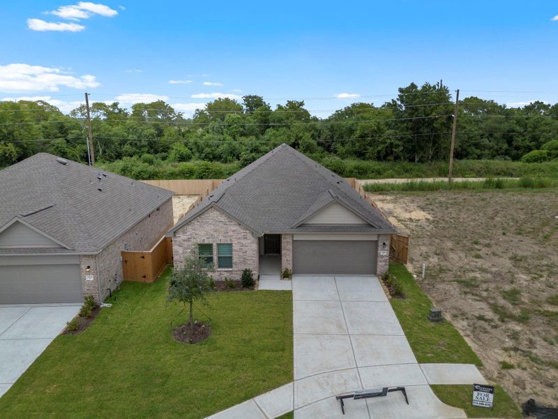 Front exterior of a new home in River Ranch Trails, Dayton, TX, highlighting curb appeal (Image 16). Front exterior of a new home in River Ranch Trails, Dayton, TX, highlighting curb appeal (Image 16).