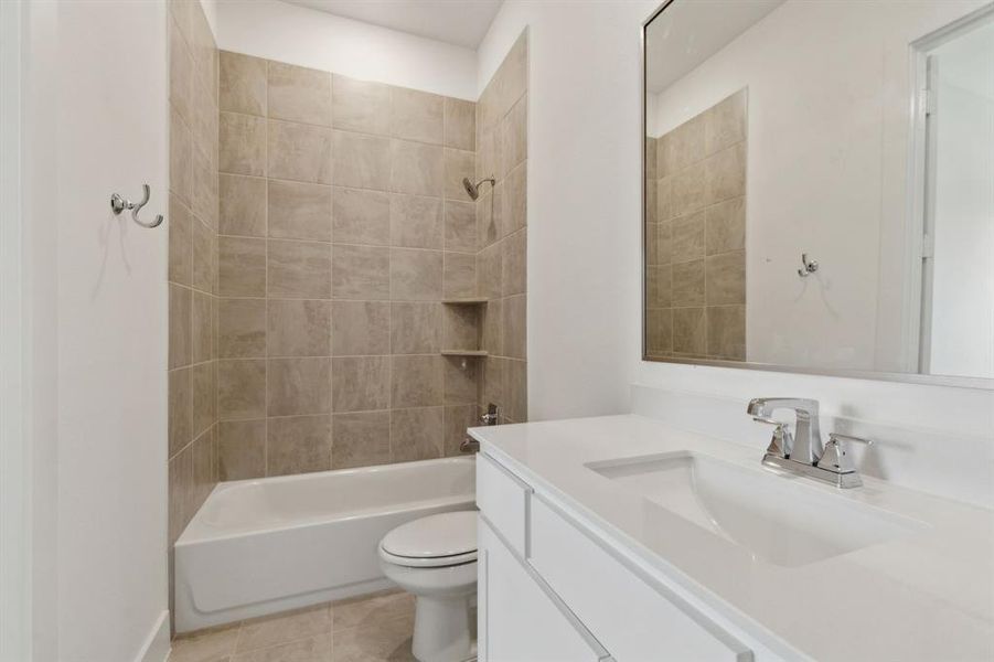 Bathroom featuring a white vanity with an integrated rectangular sink, chrome faucet, and a large mirror Bathroom featuring a white vanity with an integrated rectangular sink, chrome faucet, and a large mirror