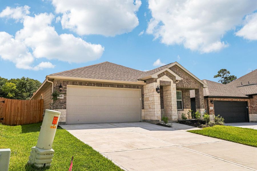 Front exterior of a new home in Pine Lake Cove - Premier Series, Montgomery, TX, highlighting curb appeal (Image 11).