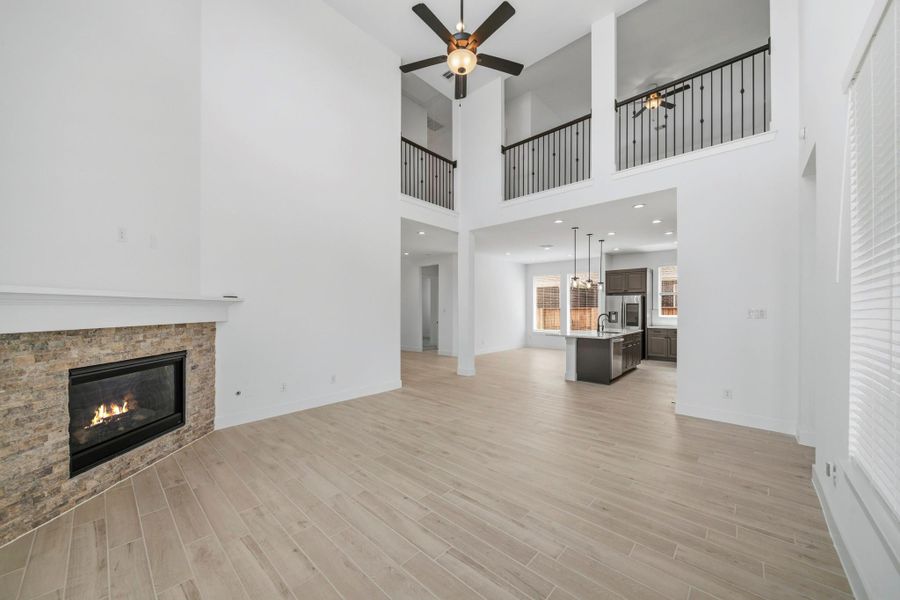 Another view shows just how open concept this kitchen and living room is. So much natural light and space! This light and bright spacious living room is the perfect layout for entertaining or just relaxing!