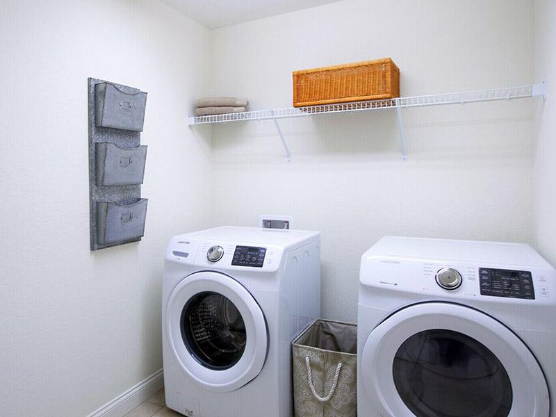 Dedicated laundry room at garage entry - Ryleigh home plan by Highland Homes