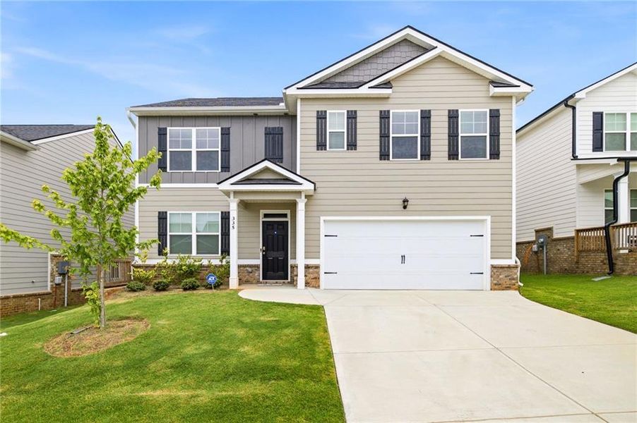 Front exterior of a new home in Twin Lakes, Hoschton, GA, highlighting curb appeal (Image 27).