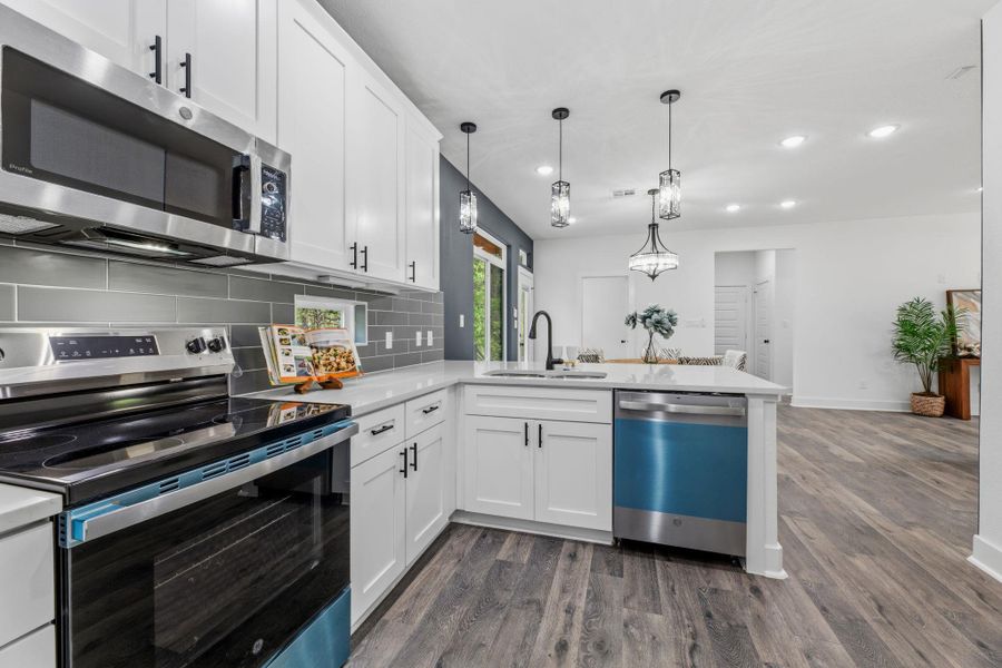 Culinary aspirations come alive in this kitchen, featuring sleek stainless steel appliances and an inviting open floor plan.