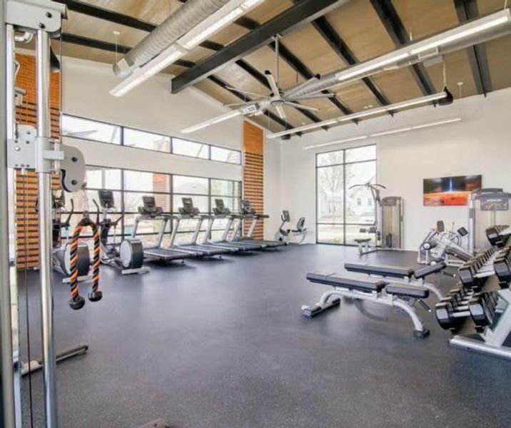 Workout area with a towering ceiling