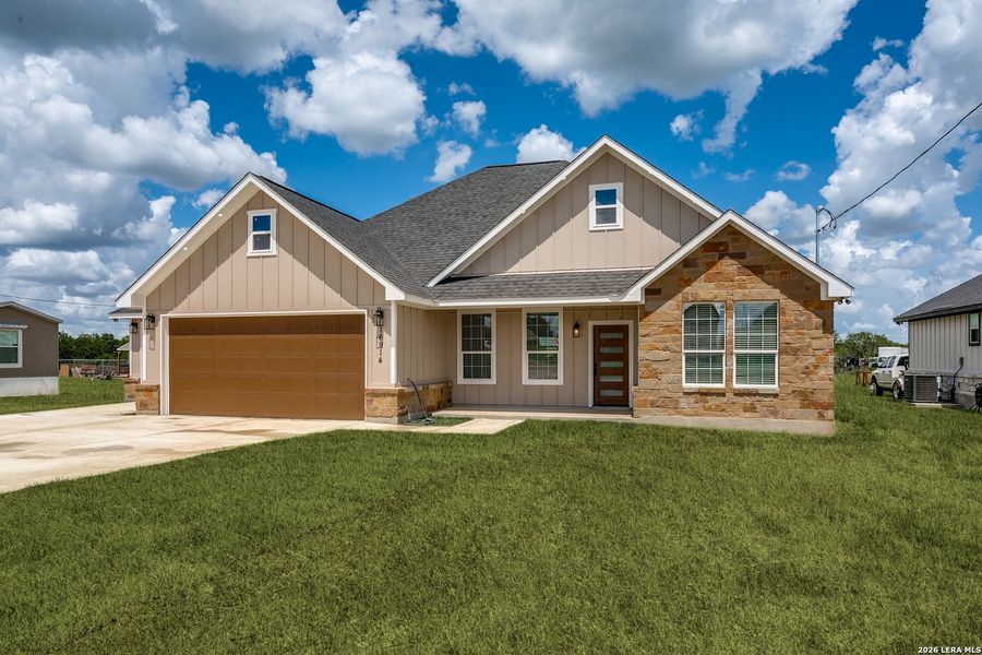 Front exterior of a new home in , Atascosa, TX, highlighting curb appeal (Image 2). Front exterior of a new home in , Atascosa, TX, highlighting curb appeal (Image 2).