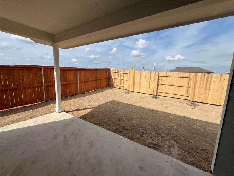 Exterior details and patio area of a home in The Homestead at Lariat, Liberty Hill (Image 14).