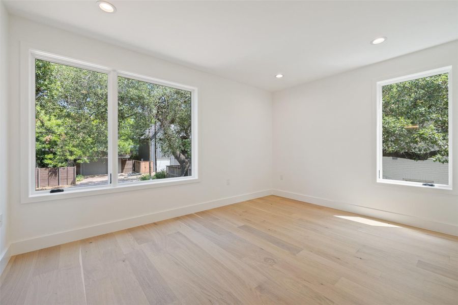 Unfurnished room featuring recessed lighting and light wood-style floors Unfurnished room featuring recessed lighting and light wood-style floors