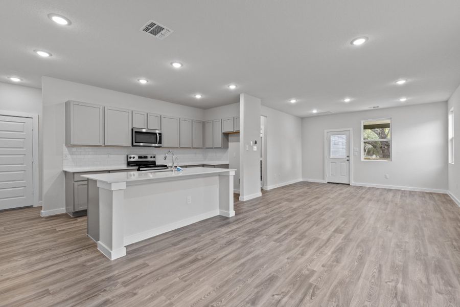 A kitchen with white cabinets. A kitchen with white cabinets.