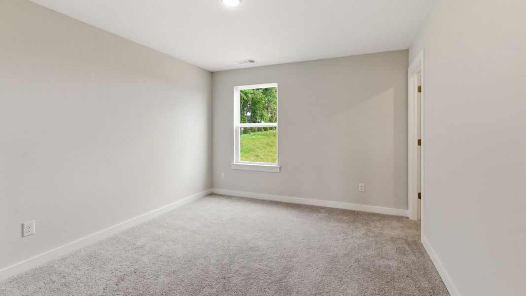 Bedroom with carpet and window Bedroom with carpet and window