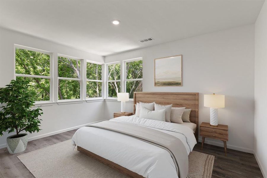 Bedroom featuring baseboards, wood finished floors, and recessed lighting Bedroom featuring baseboards, wood finished floors, and recessed lighting