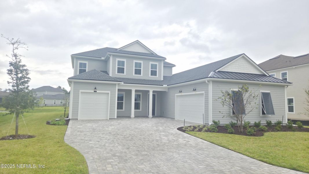 Front exterior of a new home in , St. Johns, FL, highlighting curb appeal (Image 1).